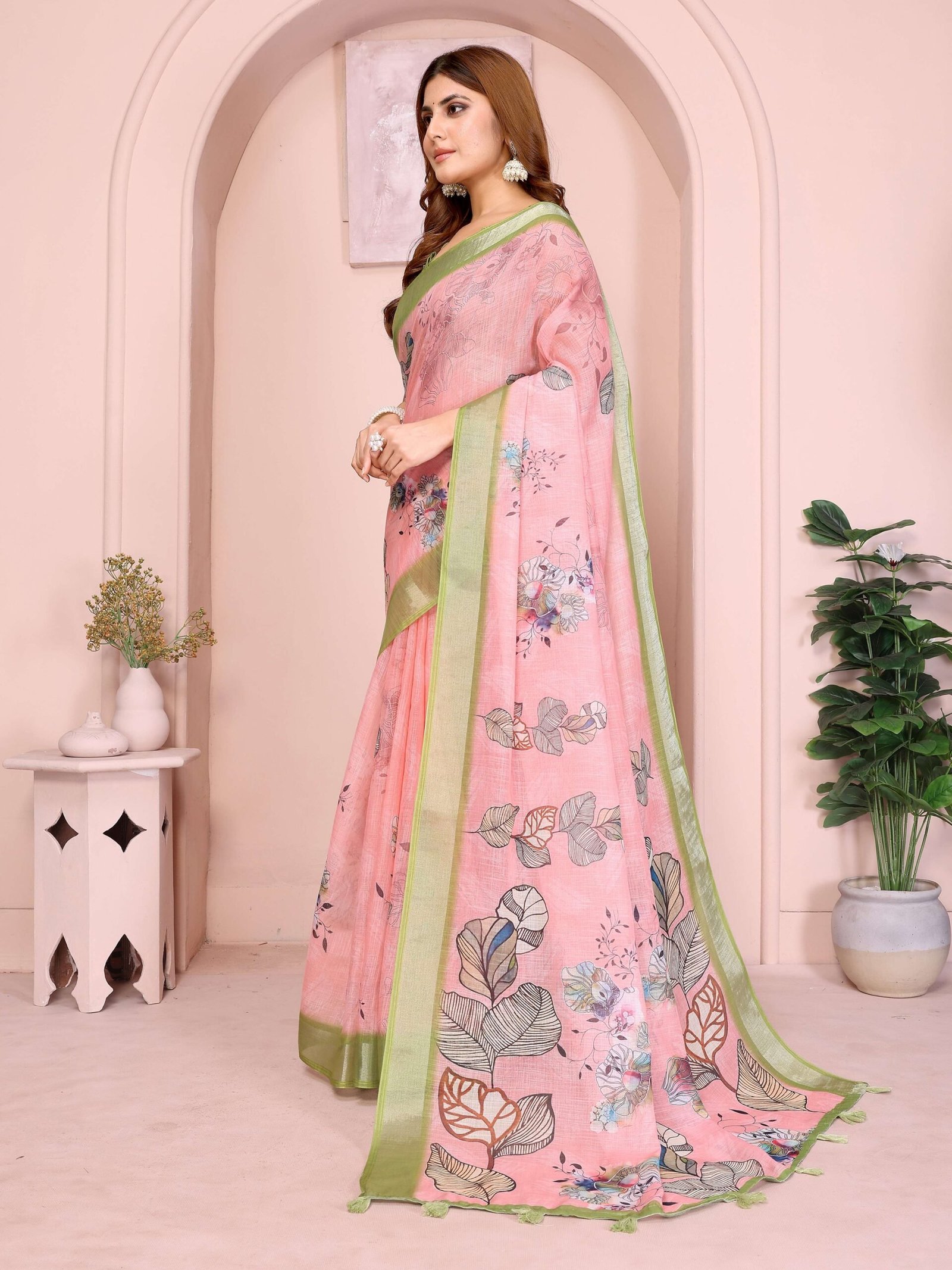 Graceful Pastel Pink Linen Cotton Saree with Multicolor Floral Prints & Green Tassel Border