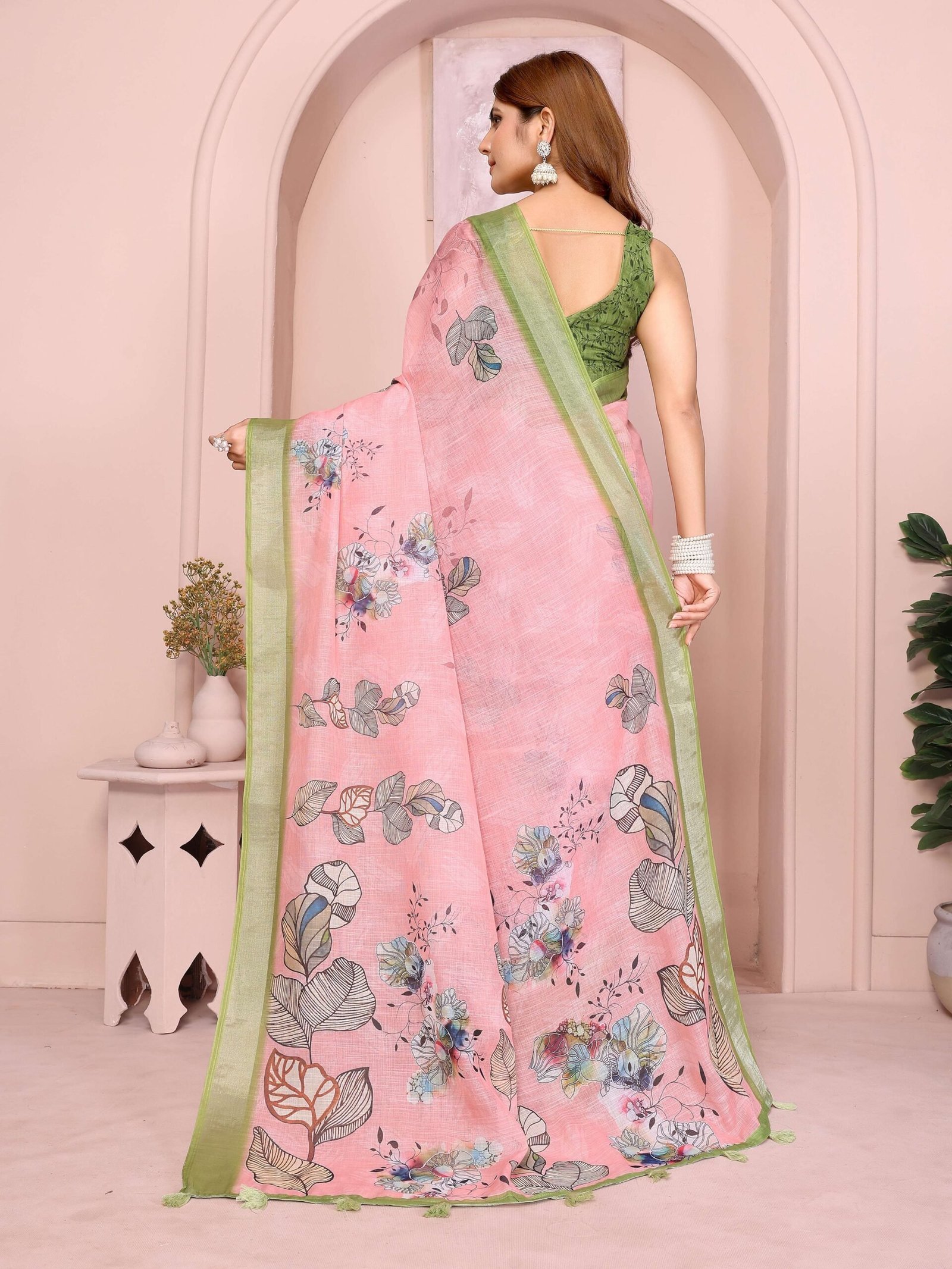 Graceful Pastel Pink Linen Cotton Saree with Multicolor Floral Prints & Green Tassel Border